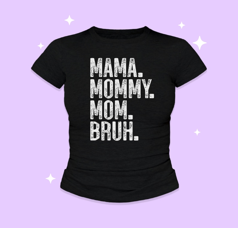 May include: A black short-sleeved t-shirt featuring white distressed-style text printed on the front. The text is stacked in four lines and reads: MAMA. MOMMY. MOM. BRUH. The shirt has a crew neckline and a standard fit, presented against a light purple background.