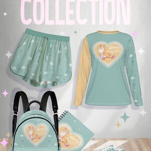 May include: A teal blue and yellow cat eye themed clothing collection featuring a long-sleeved shirt, shorts, a backpack, a notebook, and sneakers. The shirt, backpack, and notebook all feature a heart with a cat inside and the text "Khajiit,  Master of Thieves,  Meow!" The shorts and sneakers have a repeating pattern of cat eyes.