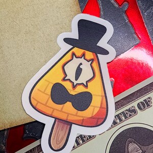 May include: A yellow triangle-shaped popsicle with a black top hat, a black bow tie, and a single eye. The popsicle is on a stick.