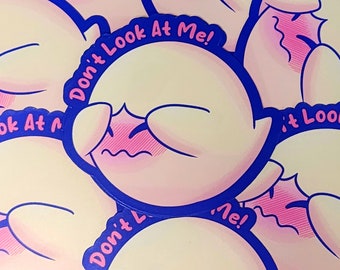May include: A stack of pink and yellow stickers with a cartoon ghost character. The ghost is blushing and has its eyes closed. The text on the sticker says "Don't Look At Me!"