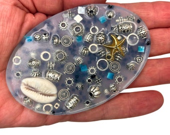 Treasures Of The Sea Picking Pad Fidget Pick Palette Toy - Oval shape, treasure-filled, Textured for Picking, Digging and Peeling