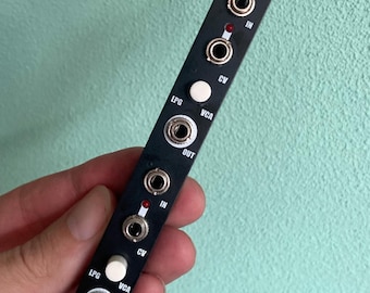 May include: Black GATEY module with white knobs and jacks. The module has labels for "LPG", "VCA", "CV", "IN", and "OUT".