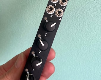 May include: Black VOLTY Eurorack module with four 1/4 inch jacks and four knobs with white pointers. The module has a white bear logo.