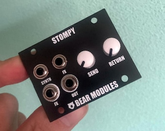 May include: Black StompY effects module with white knobs labeled "Send", "Return", and "FX".  The module has four 1/4 inch jacks labeled "Synth", "FX", "Out", and "FX".  The module is labeled "BEAR MODULES".