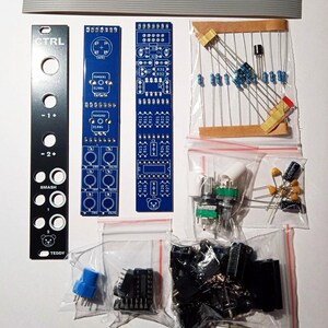 May include: An assortment of electronic components, including circuit boards, resistors, capacitors, and potentiometers. The image features a black panel with the text "CTRL" and "SMASH", along with other components in clear plastic bags. A ribbon cable is at the top.
