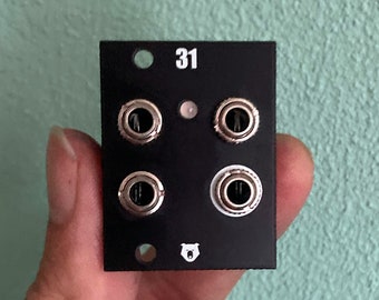 May include: Black Eurorack module with four silver jacks and the number "31" printed on the front. A white bear logo is printed in the bottom center.