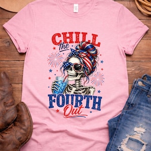 May include: Pink t-shirt with a graphic featuring a skeleton wearing sunglasses and a patriotic headband, holding a drink. The text reads "CHILL the FOURTH Out" in red and blue. Fireworks and stars complete the design.