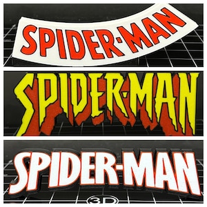 May include: Three Spider-Man logo designs. The top logo is white with red lettering. The middle logo has yellow and red lettering. The bottom logo is 3D with white and red lettering.