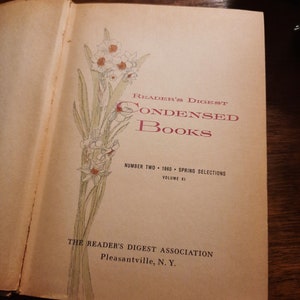 May include: A vintage book cover with a floral illustration of white daffodils. The title is "Reader's Digest Condensed Books" with the text "Number Two 1960 Spring Selections Volume XI" and "The Reader's Digest Association Pleasantville, N. Y."
