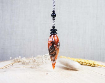 Divinatory pendulum in resin and ebony wood (Cameroon) - weighted - Length 7 cm - ø 2 cm - weight 18.5 grams. Dowsing pendulum.