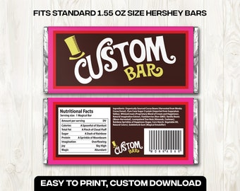 以下が含まれることがあります： 中央がダークブラウンで、白と黄色の文字でCUSTOM BARと書かれ、鮮やかなピンクの縁取りが施された長方形のチョコレートバーの包装紙デザイン。裏面には栄養成分表示とWONKABARという文字が入ったバーコードがある。