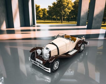 May include: A vintage-style toy car in cream and brown, with chrome accents and spoked wheels. The miniature convertible has a detailed front grille and headlights. The car is a classic model, likely a collectible item.