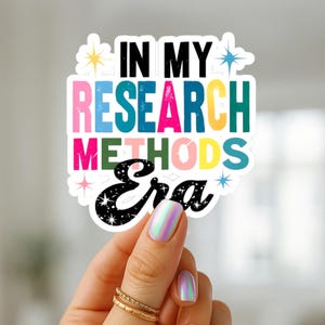 May include: A colorful sticker with the text "IN MY RESEARCH METHODS Era". The sticker has a white border and features a variety of colors, including pink, blue, yellow, and green. The word "Era" is in a black font with white stars.