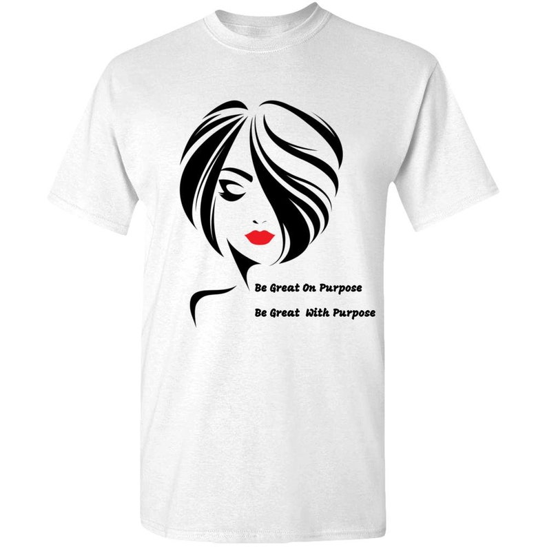 May include: White t-shirt with a black and white illustration of a woman with red lips. The text "Be Great On Purpose" and "Be Great With Purpose" is printed below the illustration.