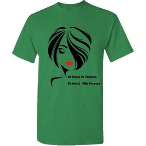 May include: Green t-shirt with a black and white silhouette of a woman with red lips. The text "Be Great On Purpose" and "Be Great With Purpose" is printed on the shirt.