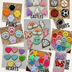 May include: Assortment of colorful felt patches in various shapes, including paws, castles, sports, smiley faces, hearts, stars, and bows. Each patch has a gold outline.