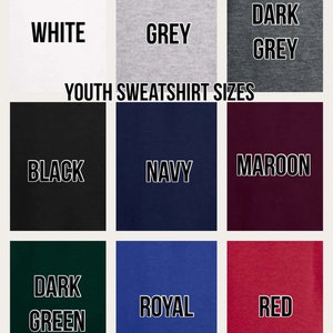 May include: A color chart showing the different colors available for youth sweatshirts. The colors are: white, grey, dark grey, black, navy, maroon, dark green, royal, and red.