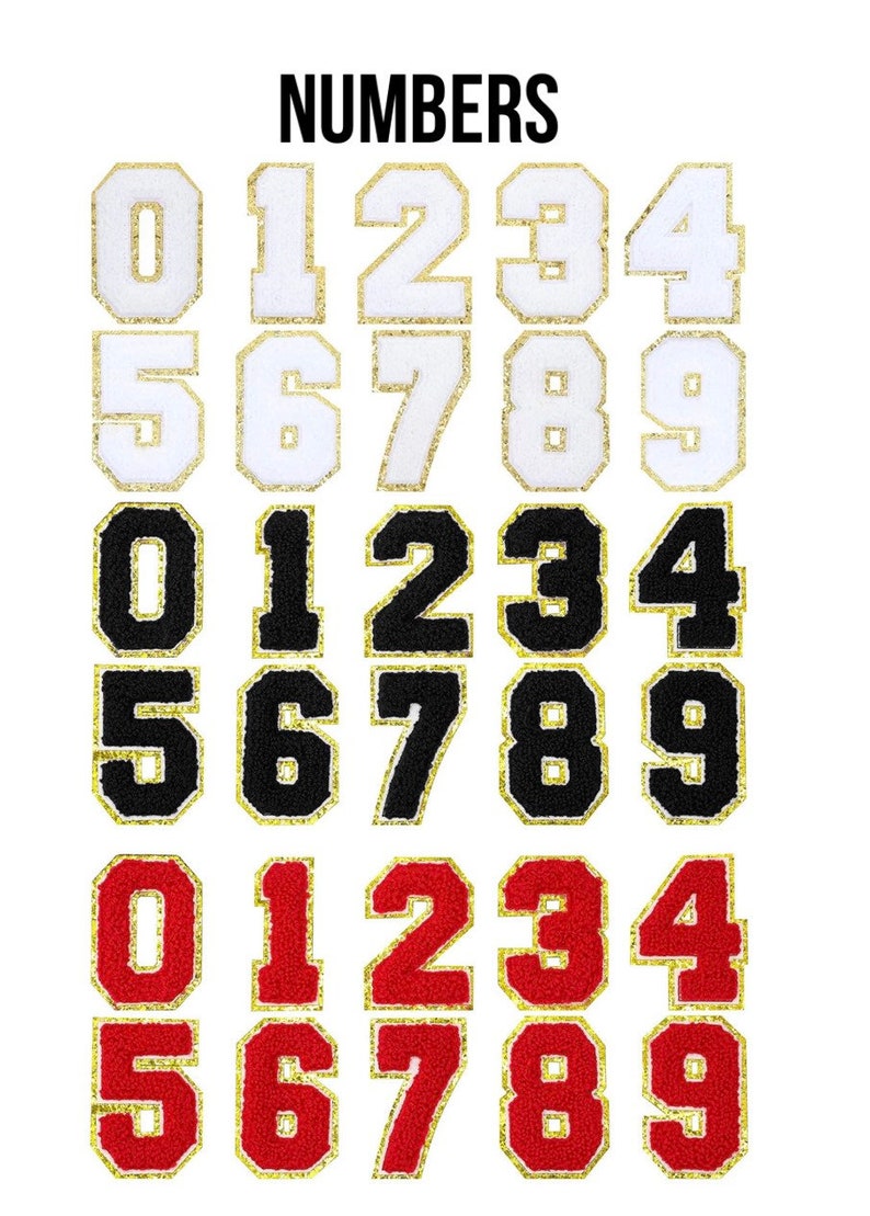 May include: Three sets of iron-on numbers, 0-9, in white with gold trim, black with gold trim, and red with gold trim. The numbers are in a block font style and are arranged in three rows.