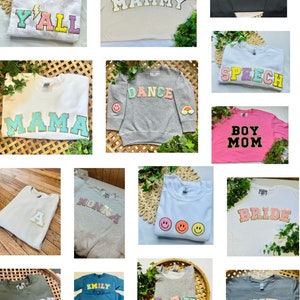 May include: A collage of 12 sweatshirts with various designs and text. The sweatshirts are in different colors, including white, gray, pink, blue, and green. The text on the sweatshirts includes "Y'all", "Mammy", "Lolli", "Speech", "Dance", "Mama", "Boy Mom", "A", "Nonna", "Bride", "Teach", "Emily Chloe Audrey", "LSU", and "Auntie".