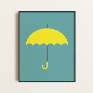 May include: A framed print of a yellow umbrella with a black handle on a teal background.