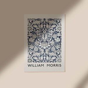 May include: A navy blue poster with a white floral pattern and the text "WILLIAM MORRIS" at the bottom.