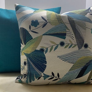 Pretty, Hummingbird Peacock Colors Pillow Cover with a Solid Teal Back