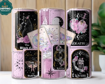 May include: Tumblers with tarot card designs. The tumblers feature illustrations of a black cat, sun, moon, moth, raven, and skeletons. The color palette includes black, pink, and gold accents. The text on the tumblers includes "The Black Cat", "Death", and "The Lovers".