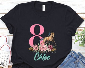 May include: Black t-shirt with a pink number 8, a brown horse, and floral accents. The text "Chloe" is printed below the horse.