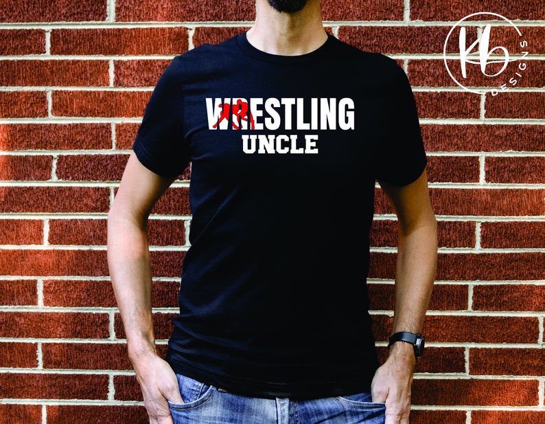 May include: A black t-shirt with white text that reads "Wrestling Uncle" and a red graphic of a wrestler.