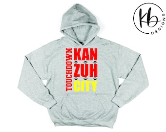 Touchdown Kan Zuh City Fashion Tee. Touchdown Kansas City T-Shirt. Touchdown Chiefs Tee. Mitch Holthus Kan Zuh City Tee. Mitch Holthus Quote