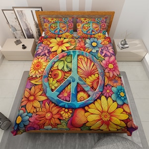 May include: A colorful peace sign quilt with a psychedelic floral pattern. The peace sign is blue and surrounded by yellow, orange, red, pink, and green flowers.