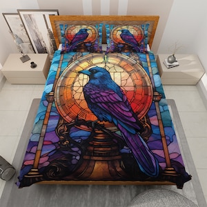 May include: A stained glass style quilt featuring a colorful raven perched on a clock face. The clock face has Roman numerals and the raven has iridescent blue and purple feathers.