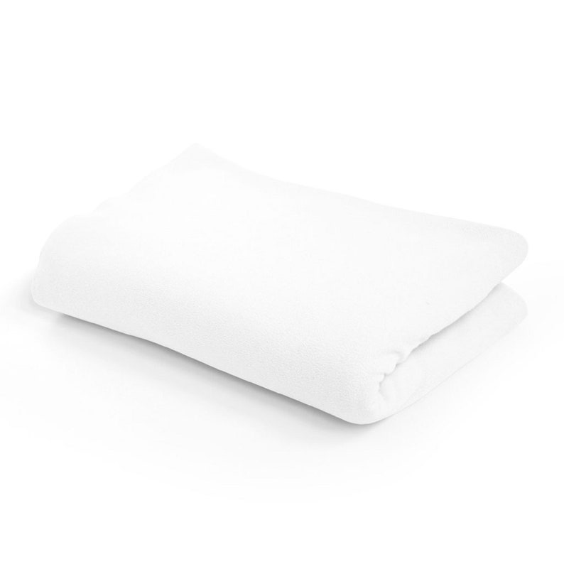May include: A white, folded, soft, and fluffy towel.