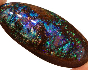 May include: An oval opal gemstone in dark brown with iridescent flashes of green, blue and purple.