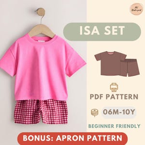 May include: A bright pink short-sleeved t-shirt and red and white checked shorts hanging on a wooden hanger. The image includes text reading ISA SET, PDF PATTERN, 06M-10Y, BEGINNER FRIENDLY, and BONUS: APRON PATTERN with a graphic illustration.