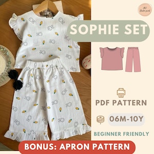 May include: White children's Sophie Set, featuring a top and pants with a bunny and carrot pattern. The top has ruffled sleeves and the pants have a ruffled hem. The image includes the text "SOPHIE SET", "PDF PATTERN", and "06M-10Y".