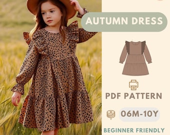 May include: A young girl wearing a brown leopard print dress and a brown hat. The dress has long sleeves and ruffles. Text on the image reads "AUTUMN DRESS", "PDF PATTERN", "06M-10Y", "BEGINNER FRIENDLY", and "BONUS: APRON PATTERN".