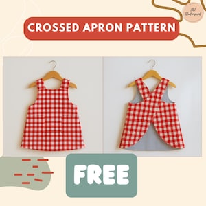 Puede incluir: Dos delantales a cuadros rojos y blancos se exhiben en perchas de madera. Un delantal se muestra desde el frente y el otro desde la parte posterior, revelando un forro a rayas azules y blancas. El texto "CROSSED APRON PATTERN" est&aacute; en la parte superior.