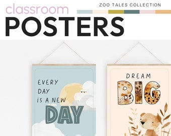 May include: Two printable classroom posters with a jungle theme. The first poster has a blue background with white clouds and a yellow sun. The text reads "Every day is a new day". The second poster has a peach background with brown grass and a small brown bear. The text reads "Dream Big".