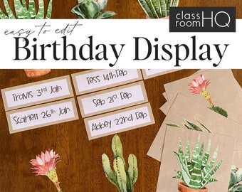 May include: A classroom birthday display with a cactus theme. The display features brown paper cards with student names and birthdays written in black marker. The cards are arranged on a wooden surface with painted cactus illustrations.