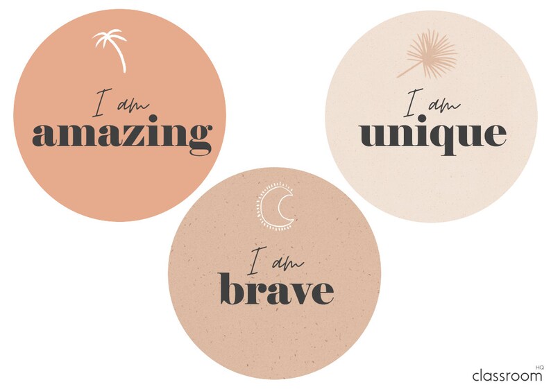 May include: Three peach-colored circles with inspirational text in black. The first circle has a palm tree and the text "I am amazing". The second circle has a crescent moon and the text "I am brave". The third circle has a feather and the text "I am unique".