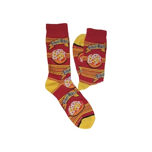 May include: A pair of crew socks featuring a red background with horizontal yellow stripes. The socks are decorated with a repeating pattern of Bagel Bites logos and illustrations of mini pizzas. The cuffs, heels, and toes are solid yellow.