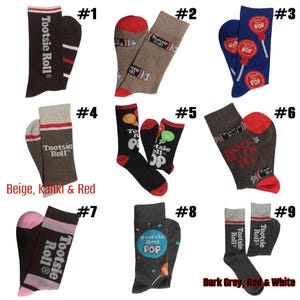 May include: Assorted pairs of socks featuring the "Tootsie Roll" and "Tootsie Pop" logos and designs. The socks come in various colors, including brown, red, blue, black, and gray. Some socks have candy-themed graphics.
