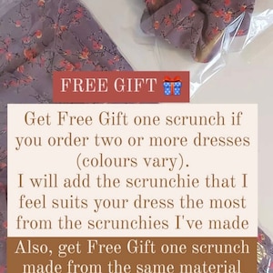 May include: A lavender fabric and scrunchie set with a floral pattern. The scrunchie is in a clear bag. The fabric and scrunchie have a lavender base with orange and pink floral accents. The text "FREE GIFT" is visible.