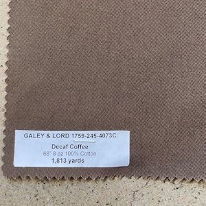 May include: A brown fabric swatch with the text "GALEY & LORD 1759-245-4073C Decaf Coffee 68" 8 oz 100% Cotton 1,813 yards".