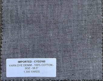 May include: A gray denim fabric swatch with a white label that reads "IMPORTED - CYD2160 YARN DYE DENIM - 100% COTTON - 9OZ - 58.5" 1,395 YARDS"