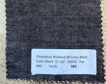 May include: A black chambray fabric swatch with a white label that reads "Chambray Washed S# Cross Black Color Black 57-58" 100%C 7oz 446 Yards SB2"