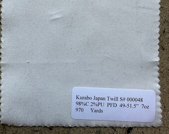 May include: White fabric swatch with a label that reads "Kurabo Japan Twill S# 000048 98%C 2%PU PFD 49-51.5" 7oz 970 Yards".