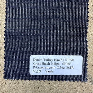 May include: A dark blue denim fabric swatch with the text "Denim Turkey Isko S# 43250 Cross Hatch Indigo 59-60" P/C(non stretch) 8.5oz 3x1R 960 Yards".