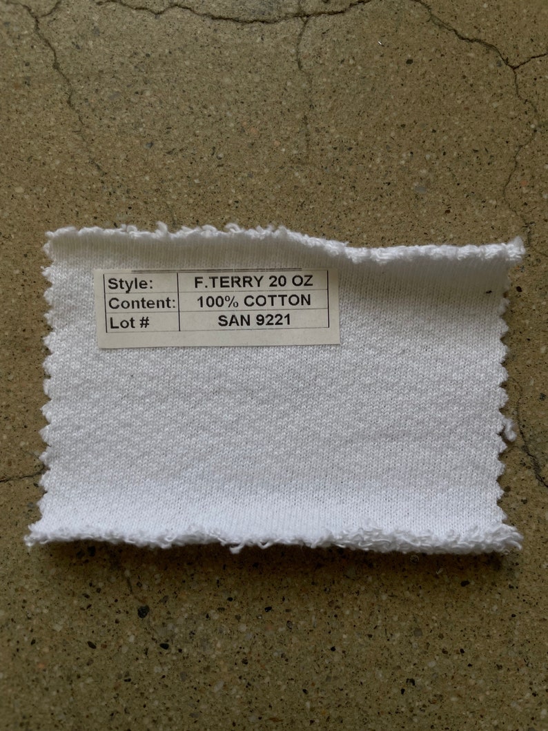 May include: White fabric swatch with a label that reads "Style: F.TERRY 20 OZ, Content: 100% COTTON, Lot#: SAN 9221".